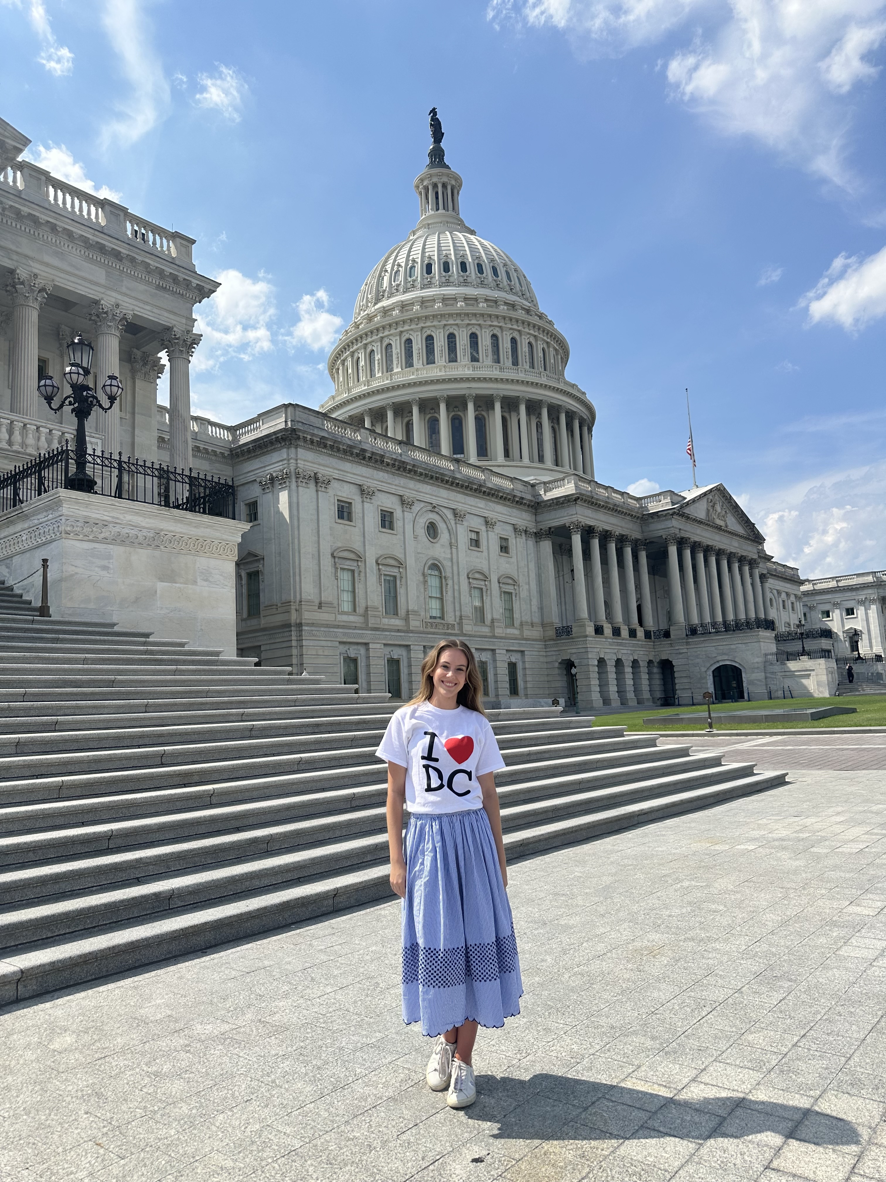 This is a photo of Ava in front of the United States Capitol In Washington D.C. where she worked as an intern for former Congresswoman Kay Granger. She is wearing an 'I Heart DC' shirt for the fun of it during her last week on the job.